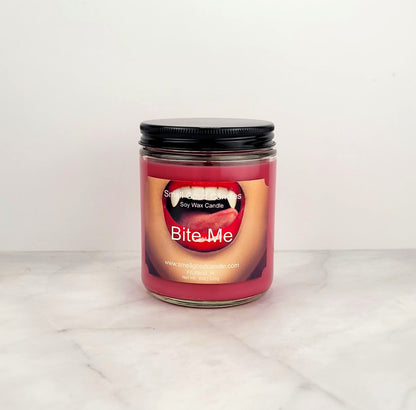 Bite Me 8oz soy wax candle with citrus, berry, and vanilla notes.