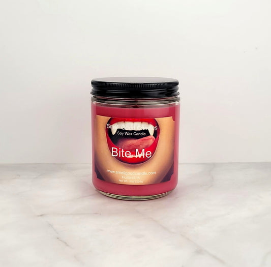 Bite Me 8oz soy wax candle with citrus, berry, and vanilla notes.