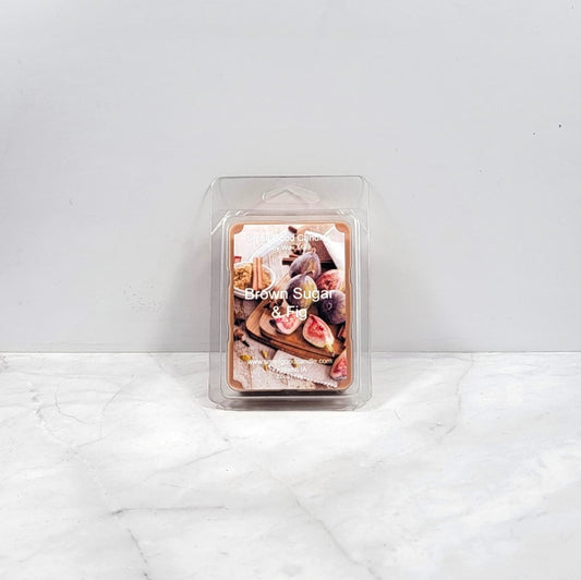 Wax melt package labeled 'Brown Sugar & Fig' on a white surface with a light gray background