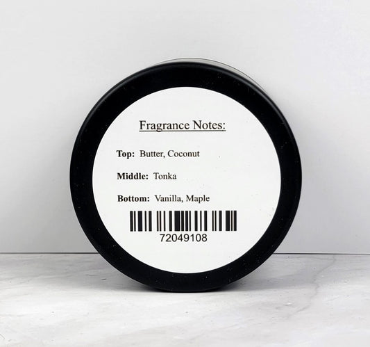 Hand-poured soy wax candle in a travel-friendly tin with a cozy café aroma