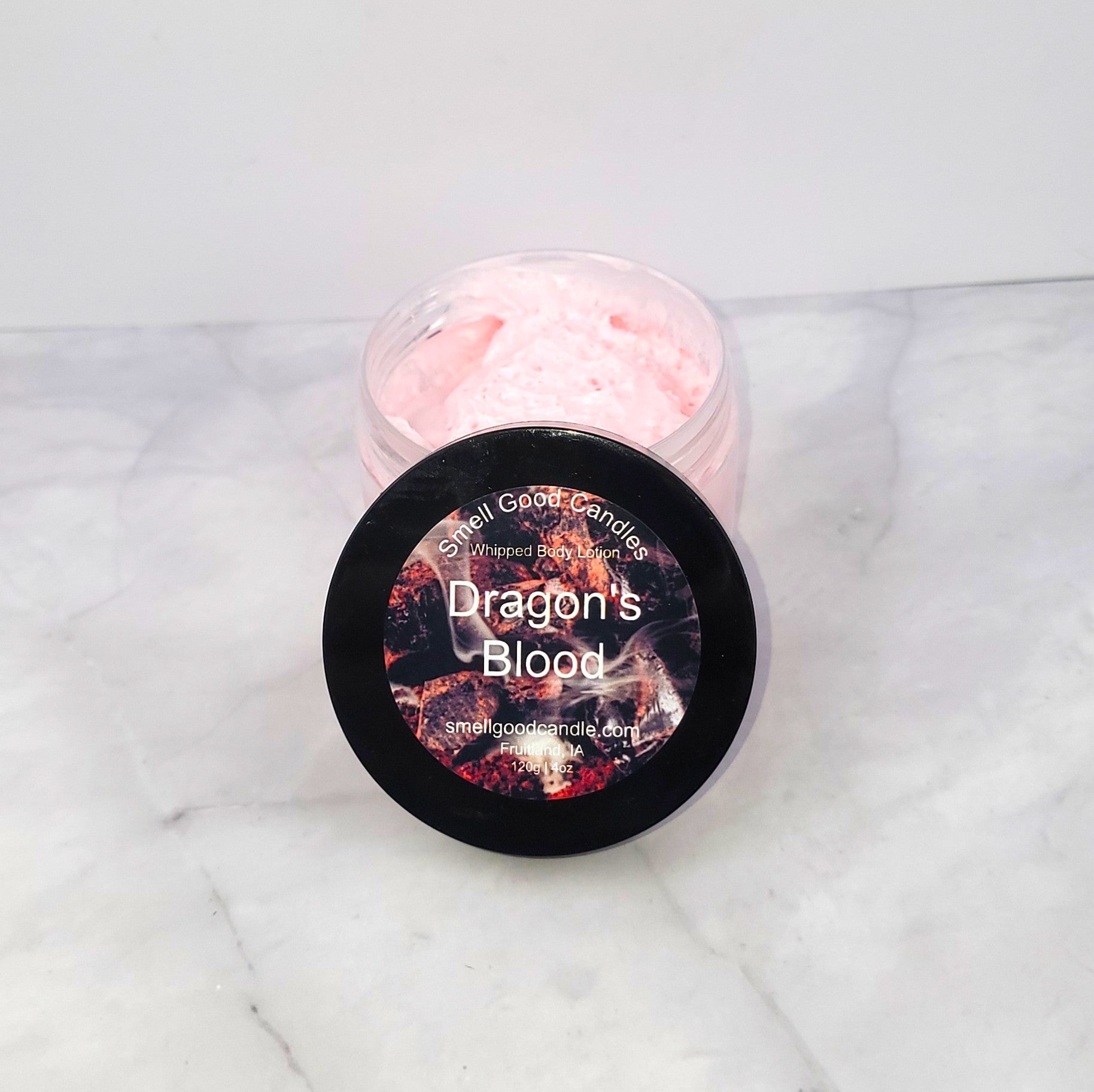 4oz Dragon’s Blood Whipped Body Lotion with citrusy orange, earthy cedar, and a spicy blend of patchouli and clove for deep hydration and a captivating scent.