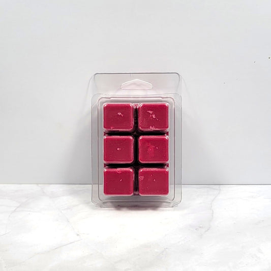 Bold earthy wax melt on dark wood with essential oils