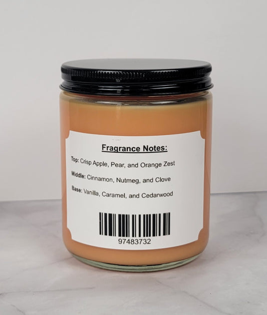 Hand-poured soy candle with cinnamon, apple, and vanilla scent.