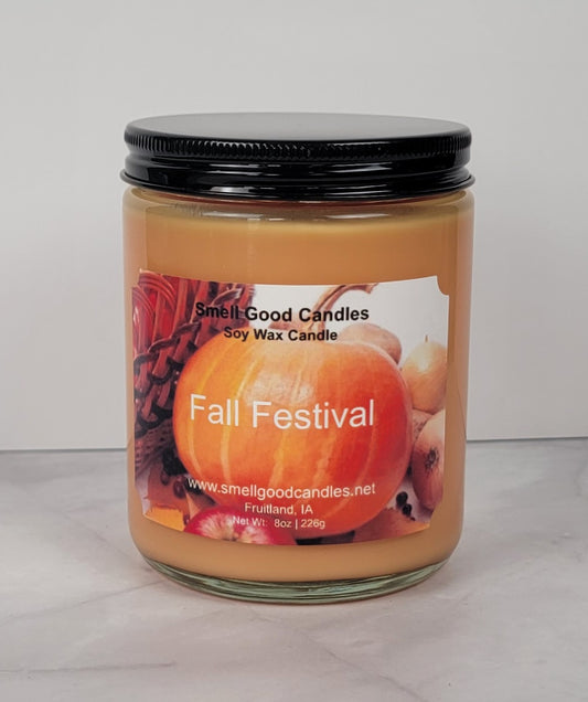 Fall Festival 8oz candle with warm autumn décor.