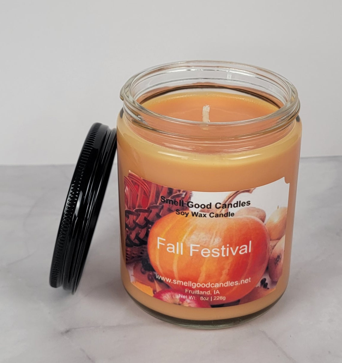 Cozy candlelit setting with fall festival ambiance.