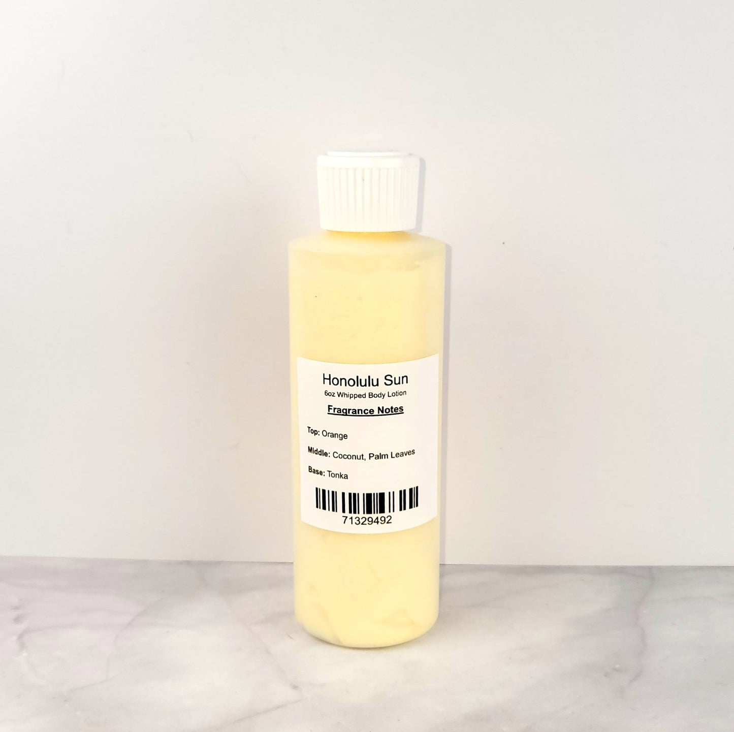 Luxury whipped body lotion with a sun-kissed coconut and citrus scent, similar to Bath & Body Works Honolulu Sun, offering fast-absorbing, non-greasy hydration