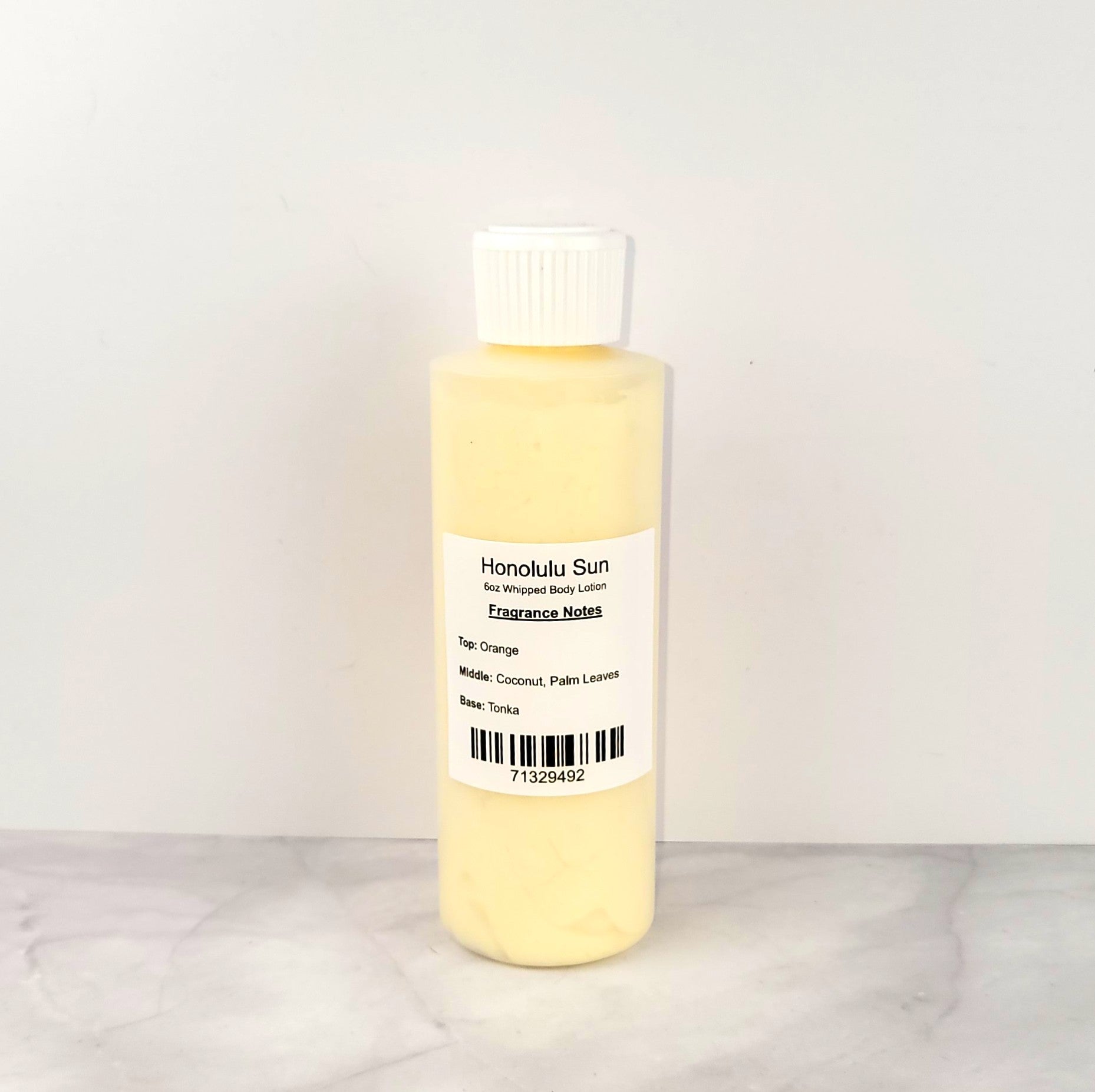 Luxury whipped body lotion with a sun-kissed coconut and citrus scent, similar to Bath & Body Works Honolulu Sun, offering fast-absorbing, non-greasy hydration
