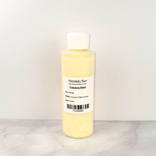 Luxury whipped body lotion with a sun-kissed coconut and citrus scent, similar to Bath & Body Works Honolulu Sun, offering fast-absorbing, non-greasy hydration