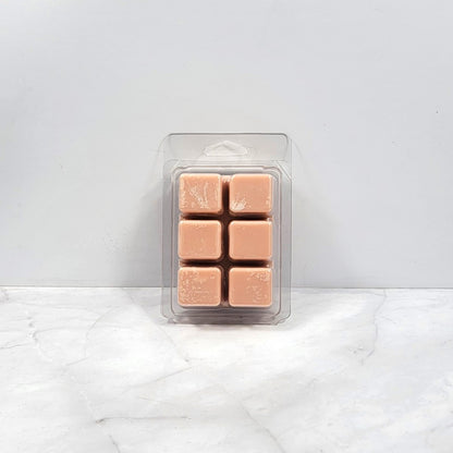 Soy wax melt with toasted marshmallows and smoky wood background