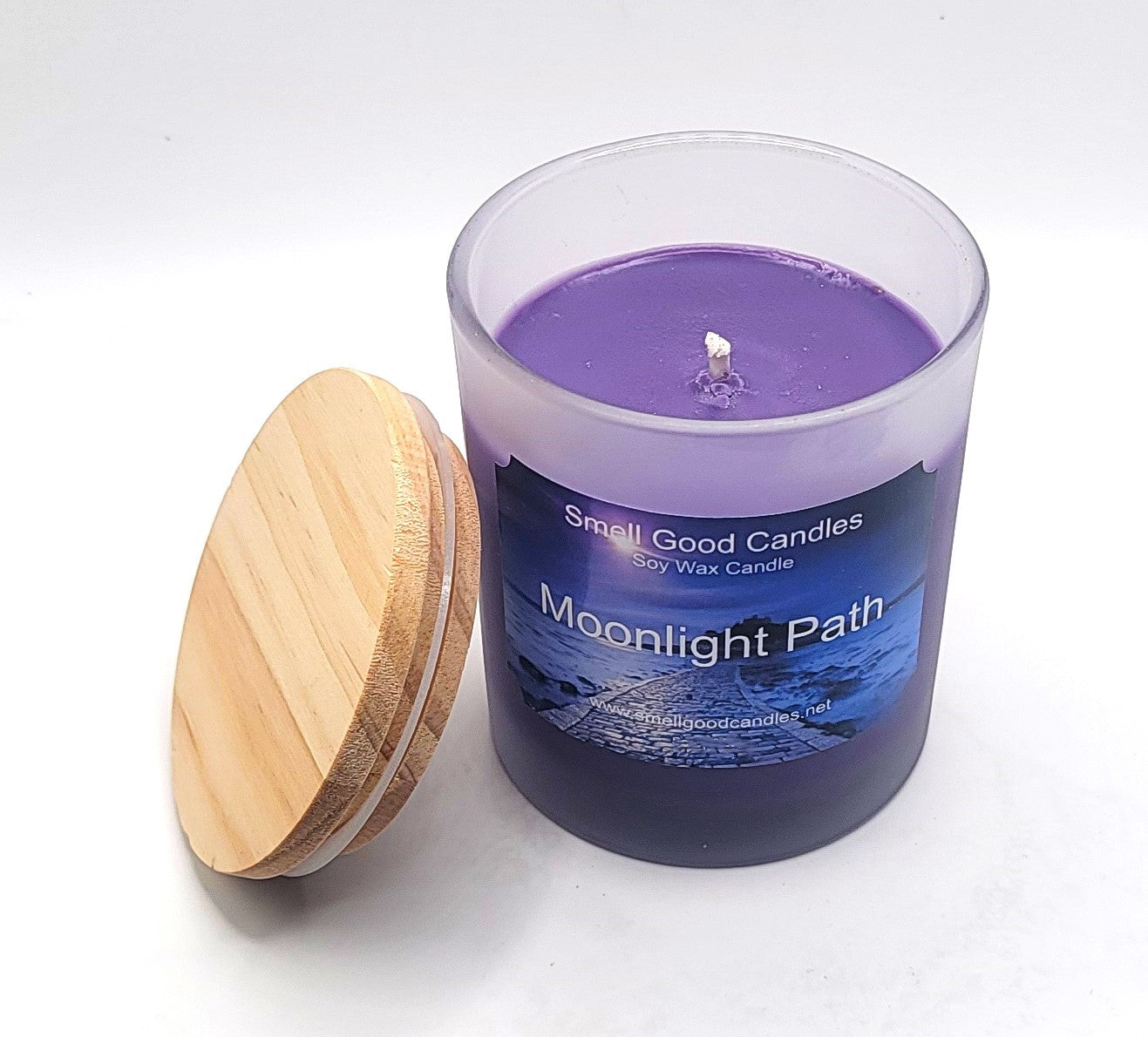 Hand-poured candle in a calming, moonlit setting.