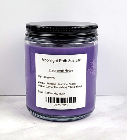 Close-up of soy wax candle with floral fragrance elements.