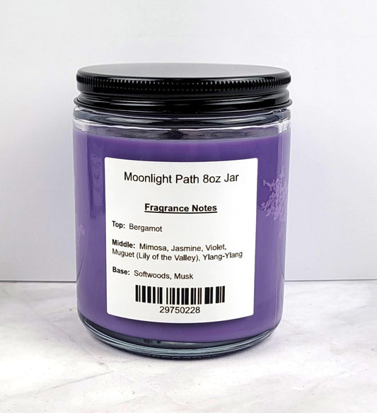 Close-up of soy wax candle with floral fragrance elements.