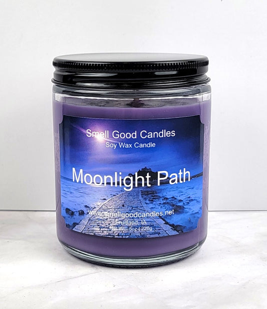 Moonlight Path 8oz candle in a cozy, softly lit setting.