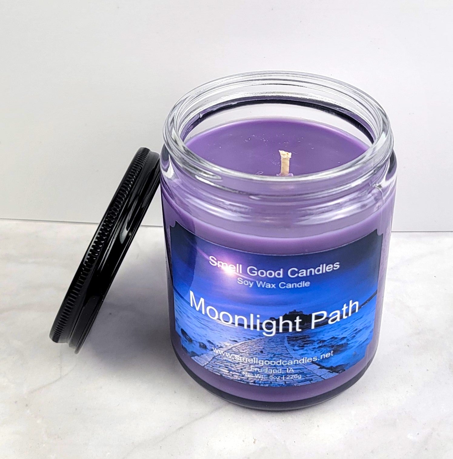 Hand-poured candle with delicate softwood and musk scent.