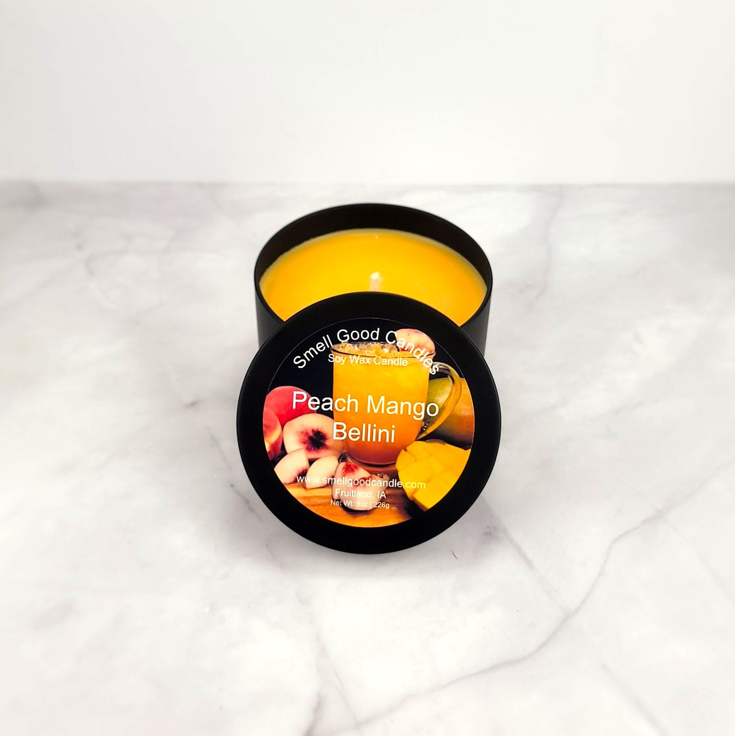 Peach Mango Bellini 8oz soy wax candle with citrus and tropical fruit notes.