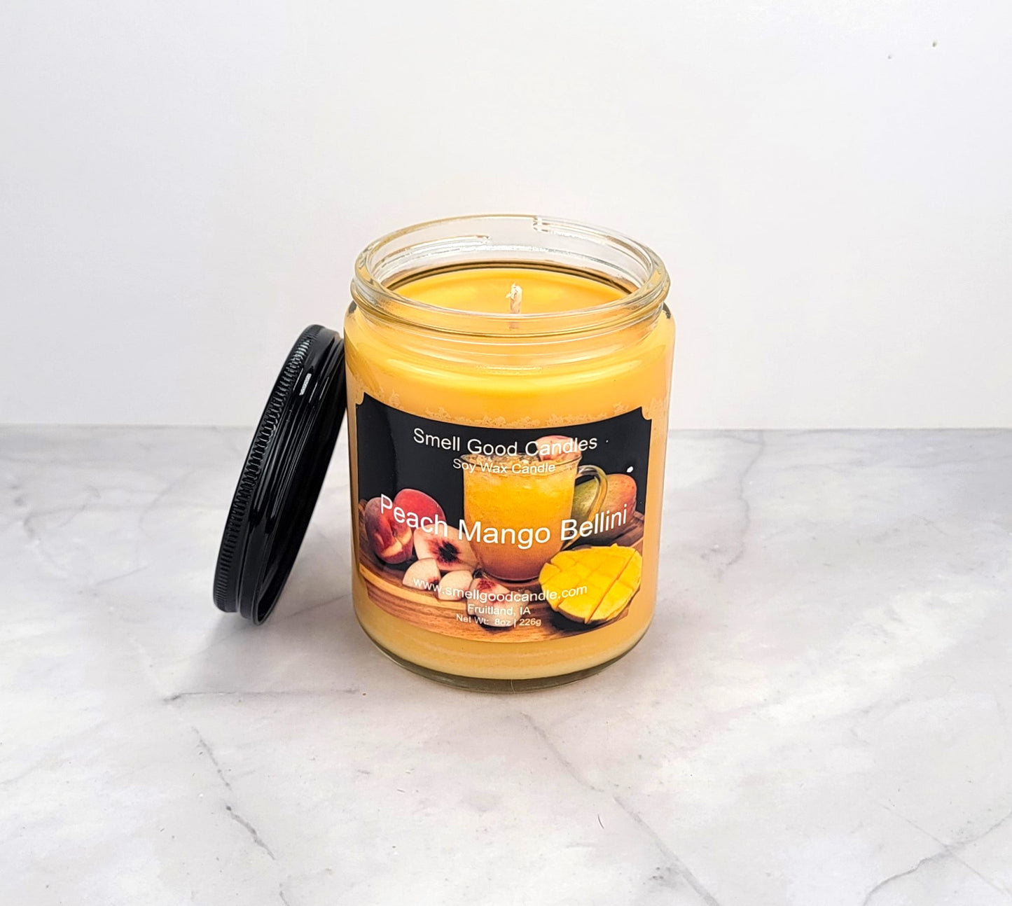 Hand-poured candle with juicy peach, mango, and warm sandalwood fragrance.
