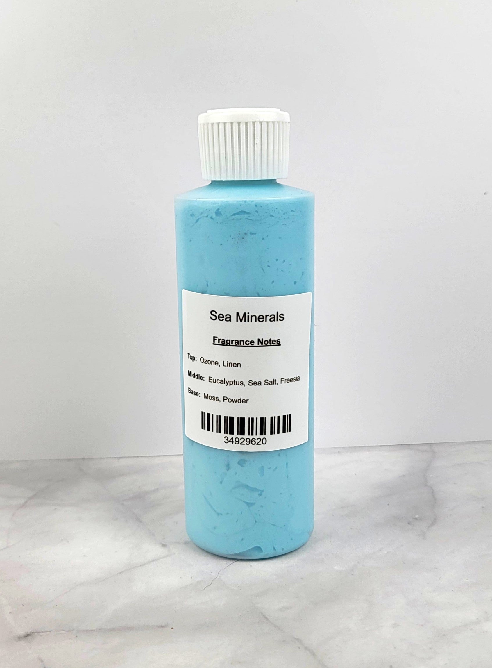 Luxurious whipped body lotion with a soft, airy texture in a smooth, creamy swirl