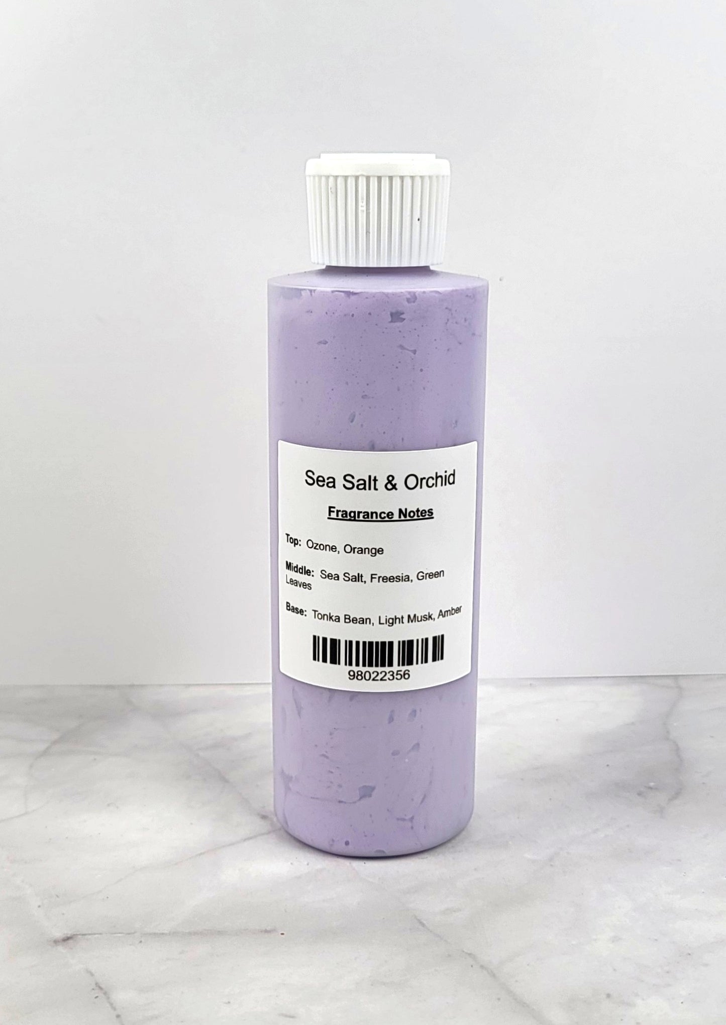 Smooth, whipped texture of Sea Salt and Orchid Body Lotion in a creamy swirl