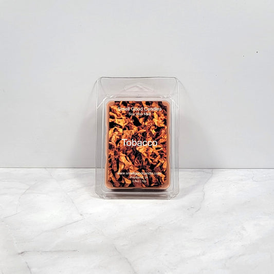 Tobacco soy wax melt with dark woods and leather backdrop