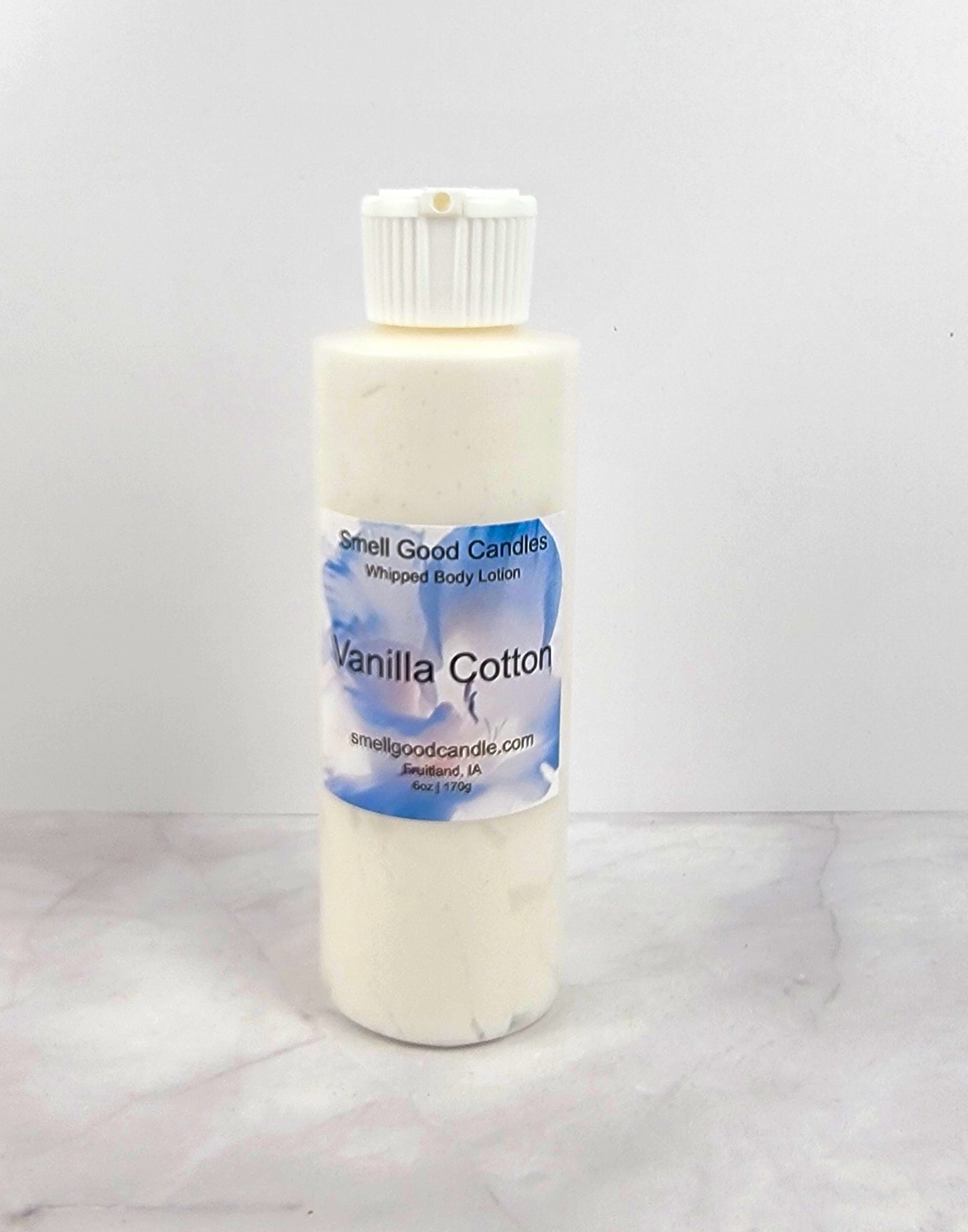 6oz Vanilla Cotton Whipped Body Lotion in a sleek jar with elegant floral design
